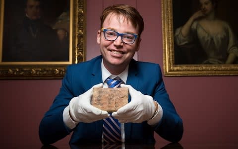 Dr Daniel Mansfield with the 3,700-year-old trigonometric table - Credit: UNSW