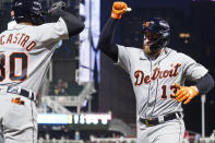 Detroit Tigers' Eric Haase (13) gets congratulated by Harold Castro after Haase's solo home run off Minnesota Twins' relief pitcher Tyler Duffey (21) in the seventh inning of a baseball game, Monday, July 26, 2021, in Minneapolis. The Twins won 6-5 in 10 innings. (AP Photo/Jim Mone)