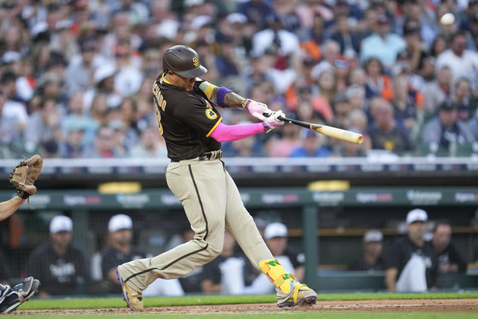 San Diego Padres' Manny Machado hits a three-run home run against the Detroit Tigers in the third inning of a baseball game, Saturday, July 22, 2023, in Detroit. (AP Photo/Paul Sancya)