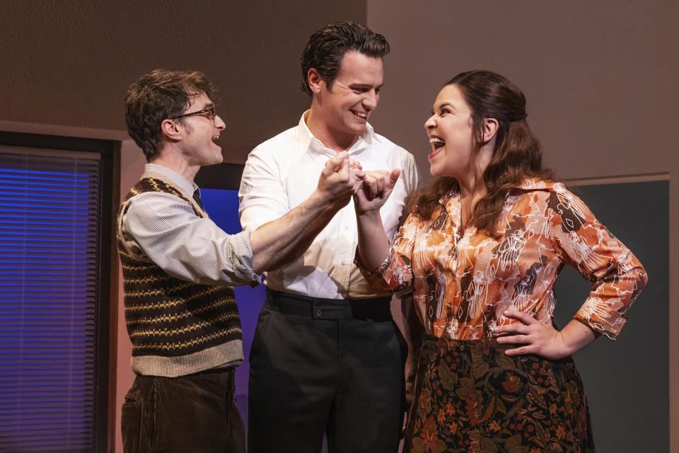 This image released by Polk & Co. shows Daniel Radcliffe, from left, Jonathan Groff and Lindsay Mendez in a scene from "Merrily We Roll Along." (Matthew Murphy/Polk & Co. via AP)