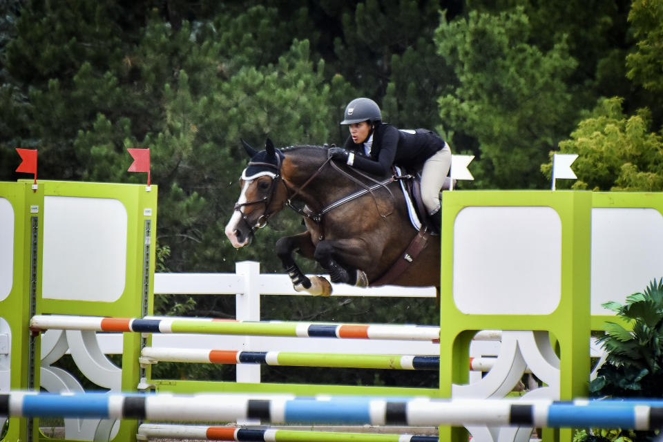 In this undated photo provided by Karie Alderman, Lauryn Gray competes during the Trillium Championships at Caledon Equestrian Park in Palgrave, Canada. One of the most candid conversations about race in sports is coming from a most unlikely of places: the show-jumping world. Gray, who has one black and one white parent, wrote a blog after she was inspired by fellow equestrian Sophie Gochman. (Karie Alderman via AP)