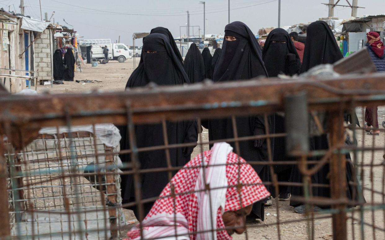 Women living in Al-Hol camp in northeast Syria have used contraband mobile phones to find love online - Sam Tarling for The Telegraph