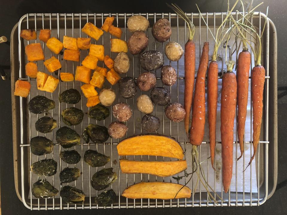 This March 2, 2020 image shows various roasted vegetables cooling on a rack in Amagansett, N.Y. The key to roasting and grilling is having the natural sugars in the vegetables browned and caramelized, resulting in both great texture and flavor. (Elizabeth Karmel via AP)