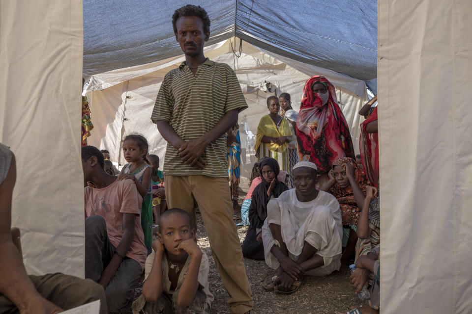 Tigray refugees who fled a conflict in the Ethiopia's Tigray region, wait to receive treatment at a clinic run by MSF (Doctors Without Borders) in Village 8, the transit centre near the Lugdi border crossing, eastern Sudan, Tuesday, Dec. 8, 2020. (AP Photo/Nariman El-Mofty)