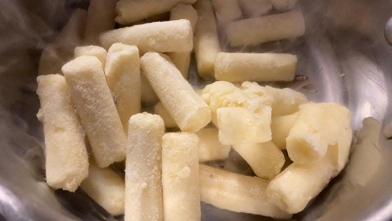 Frozen mashed potatoes in columns in a pan 