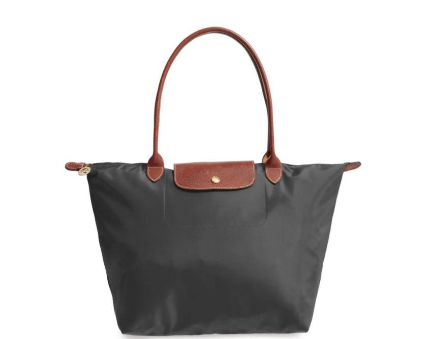 Must admit, I've never really had a lot of interest in Longchamp. Walked  past their store this morning and fell in love. Had to have it! LE PLIAGE  XTRA XS in Orange.