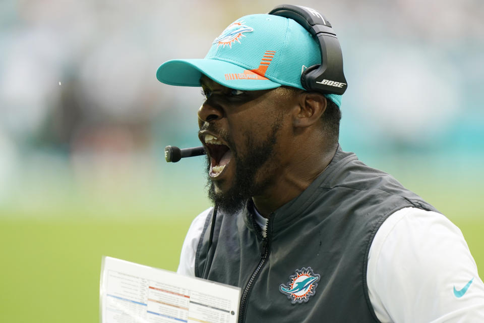 Miami Dolphins head coach Brian Flores gestures during the first half of an NFL football game against the New York Jets, Sunday, Dec. 19, 2021, in Miami Gardens, Fla. (AP Photo/Wilfredo Lee)