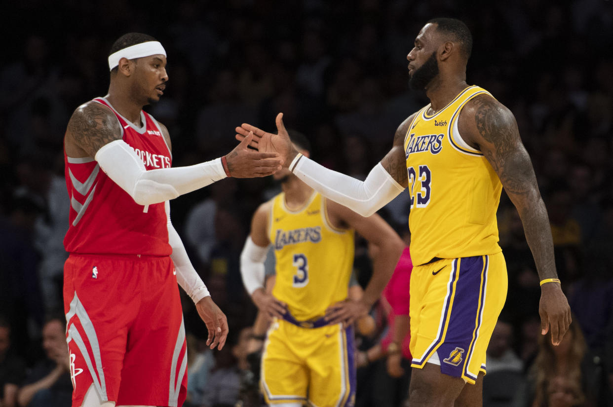 LOS ANGELES, CA - OCTOBER 20: Carmelo Anthony #7 of the Houston Rockets shakes hands with his good friend LeBron James #23 of the Los Angeles Lakers after the Lakers' home opener against the Houston Rockets at Staples Center in Los Angeles on Saturday, October 20, 2018. The Los Angeles Lakers defeated the Houston Rockets 124-115. (Photo by Kevin Sullivan/Digital First Media/Orange County Register via Getty Images)