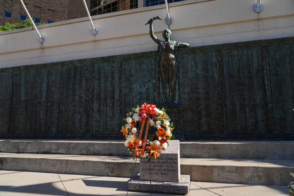 The wreath sits at the Frank Denius Veterans Memorial Plaza at the stadium.