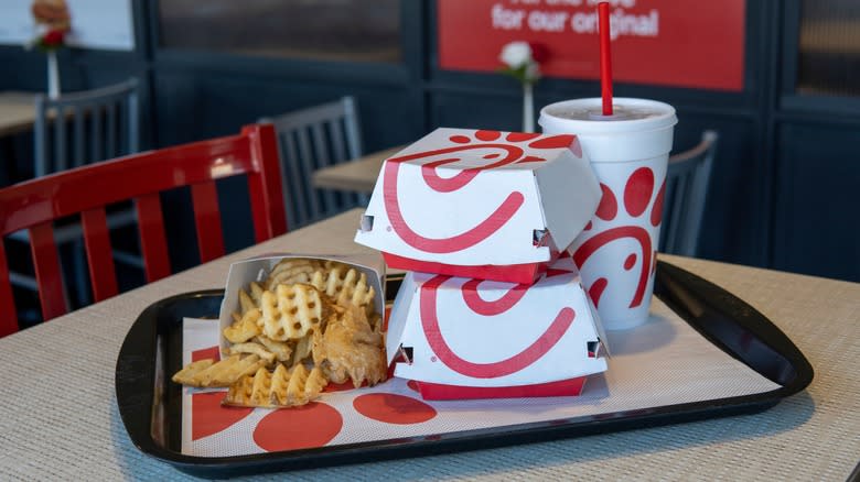 Chick-fil-a food containers stacked on a tray