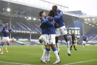 Everton's James Rodriguez celebrates after scoring his side's third goal during the English Premier League soccer match between Everton and Brighton at the Goodison Park stadium in Liverpool, England, Saturday, Oct. 3, 2020. (Jan Kruger/Pool via AP)