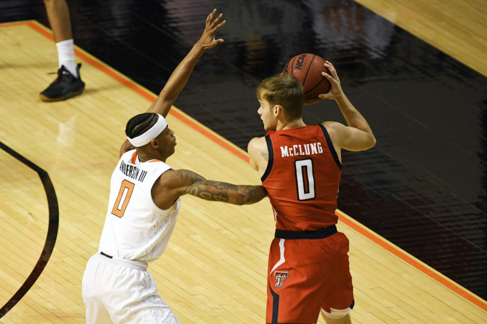 Oklahoma State guard Avery Anderson III (0) guards against Texas Tech guard Mac McClung (0) during an NCAA college basketball game Monday, Feb. 22, 2021, in Stillwater, Okla. (AP Photo/Brody Schmidt)