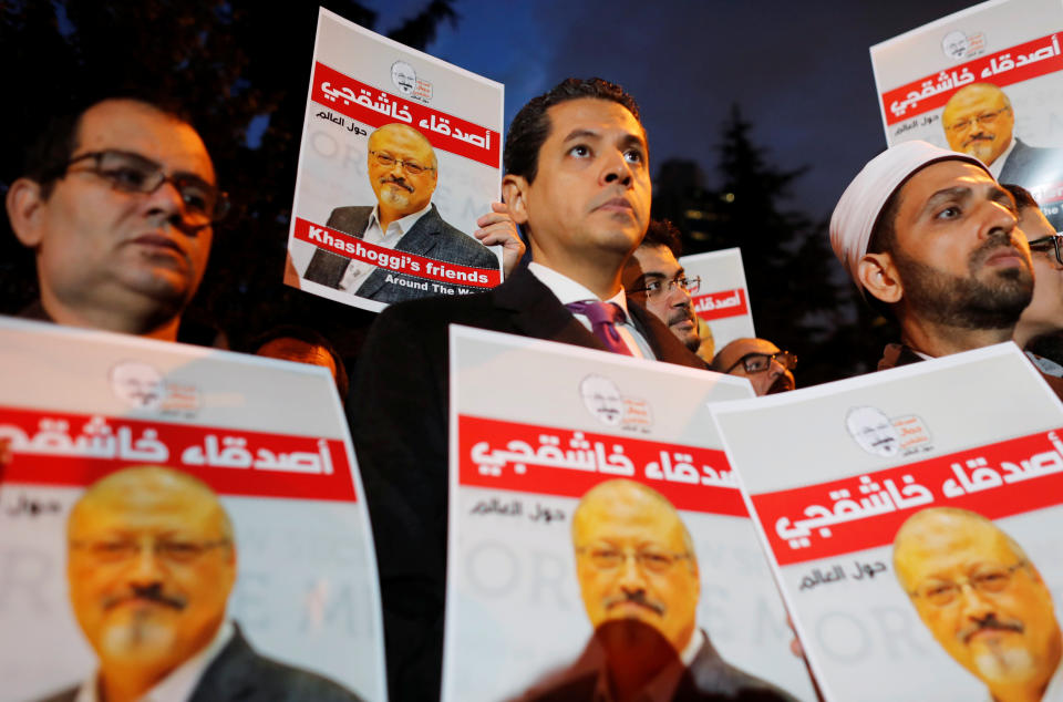 Demonstrators hold posters with picture of Saudi journalist Jamal Khashoggi outside the Saudi Arabia consulate in Istanbul, Turkey October 25, 2018. REUTERS/Osman Orsal NO RESALES. NO ARCHIVES