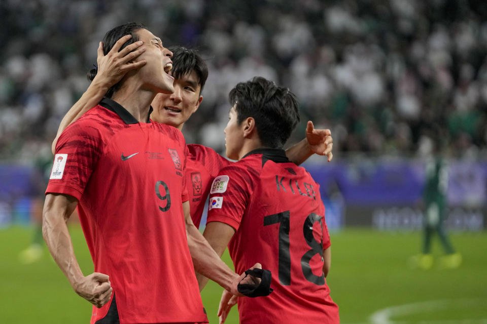 South Korea's Cho Gue-Sung, left, celebrates with teammates after scoring his side's opening goal during the Asian Cup Round of 16 soccer match between Saudi Arabia and South Korea, at the Education City Stadium in Al Rayyan, Qatar, Tuesday, Jan. 30, 2024. (AP Photo/Thanassis Stavrakis)
