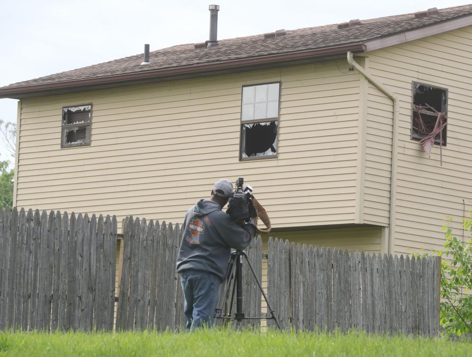 A Fox 8 videographer at the scene of a fatal house fire at the corner of 7th Avenue and Homestead Street on Tuesday, May 24, 2022 in Akron.