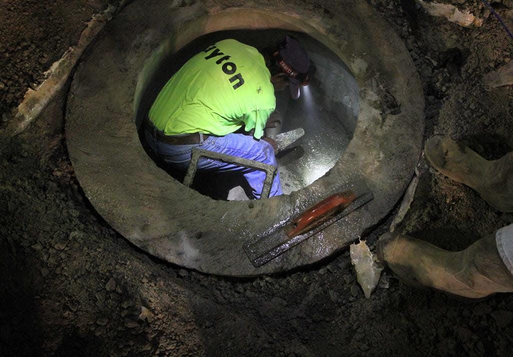 Crews with James L Cayton Associates are replaced a sewer main and installed other upgrades on Aug. 18, 2020, before asphalt resurfaced as part of the City of New Bern's Front Street Water & Sewer Improvements Project.