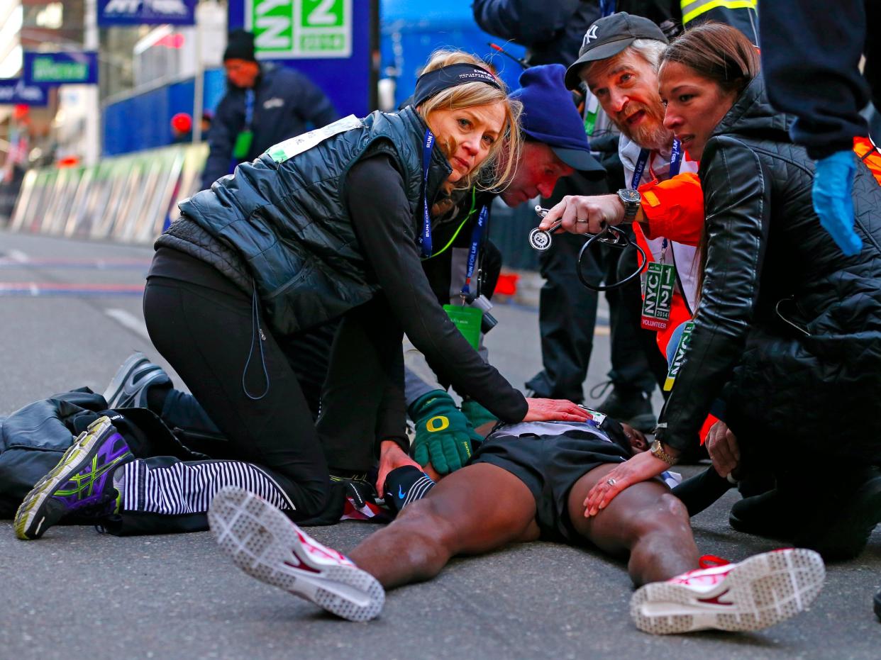 Mary Wittenberg tending to a collapsed Mo Farah