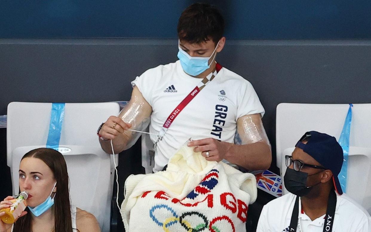 Tom Daley knits during the men’s 3m springboard event - Reuters