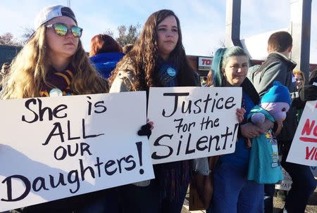 Students at Norman High School walk out of classes in Norman, Oklahoma November 24, 2014 to protest what they said was a failure by school administrators to take care of three girls who have accused a male classmate of sexually assaulting them. REUTERS/Heide Brandes (REUTERS - Tags: CRIME LAW)