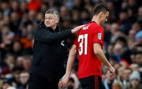 Manchester United's Nemanja Matic with manager Ole Gunnar Solskjaer as he walks off after being shown a red card by referee Kevin Friend - Credit: REUTERS