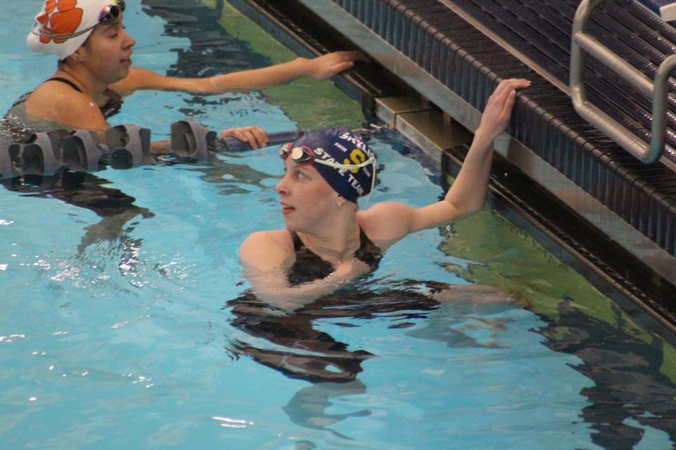 Skyline junior Jade Garstang checks her time after touching the wall during her state record performance in the 100-yard butterfly during the 5A state meet preliminary races on Friday, Feb. 23 at BYU. | Provided by Brigitte Garstang