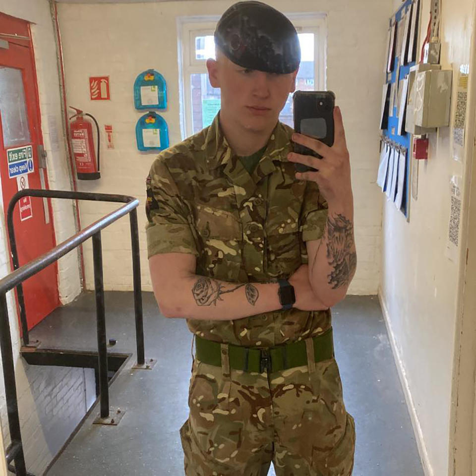 Jack Burnell-Williams wearing army gear and taking a selfie in the mirror