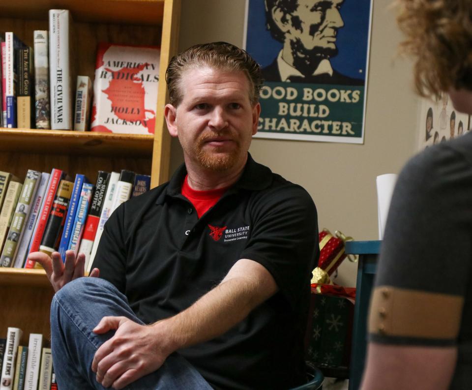 Adam J. Kuban, professor of journalism at Ball State University, speaks with Margaret Christopherson, a reporter from the Journal & Courier, about his new book "Facing Social Justice in Sports", on Friday, Dec. 2, 2022, at Main Street Books in Lafayette, Ind.