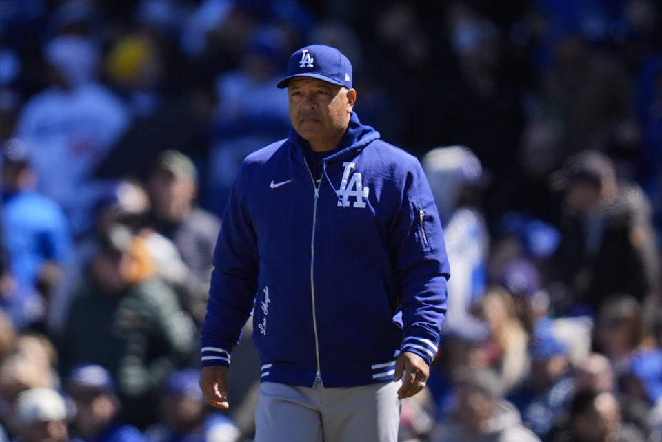 Los Angeles Dodgers manager Dave Roberts walks to the mound to make a pitching change during the second inning of a baseball game against the Chicago Cubs, Friday, April 5, 2024, in Chicago. (AP Photo/Erin Hooley)