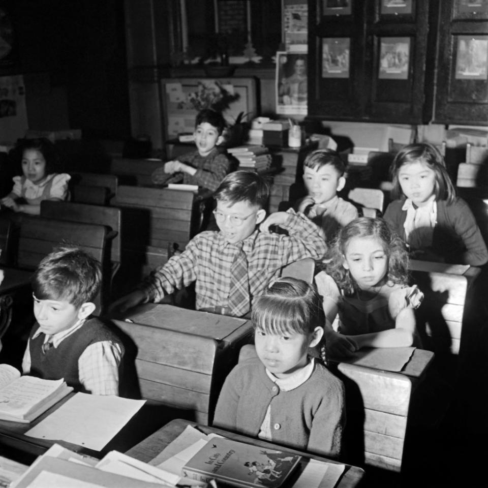 a old classroom of white and Chinese students