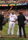 Los Angeles Angels' Albert Pujols tips his cap during introductions prior to a baseball game against the Kansas City Royals, Friday, April 6, 2012, in Anaheim, Calif. (AP Photo/Mark J. Terrill)