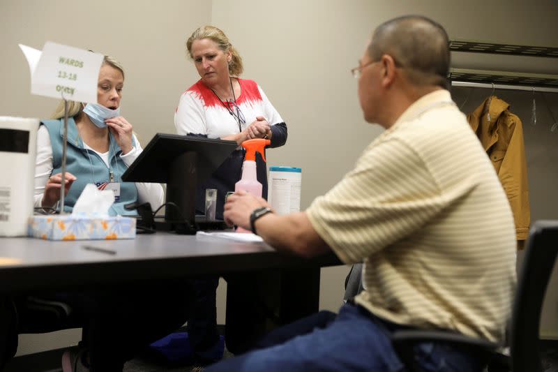 Absentee ballots are counted during the presidential primary election in Wisconsin