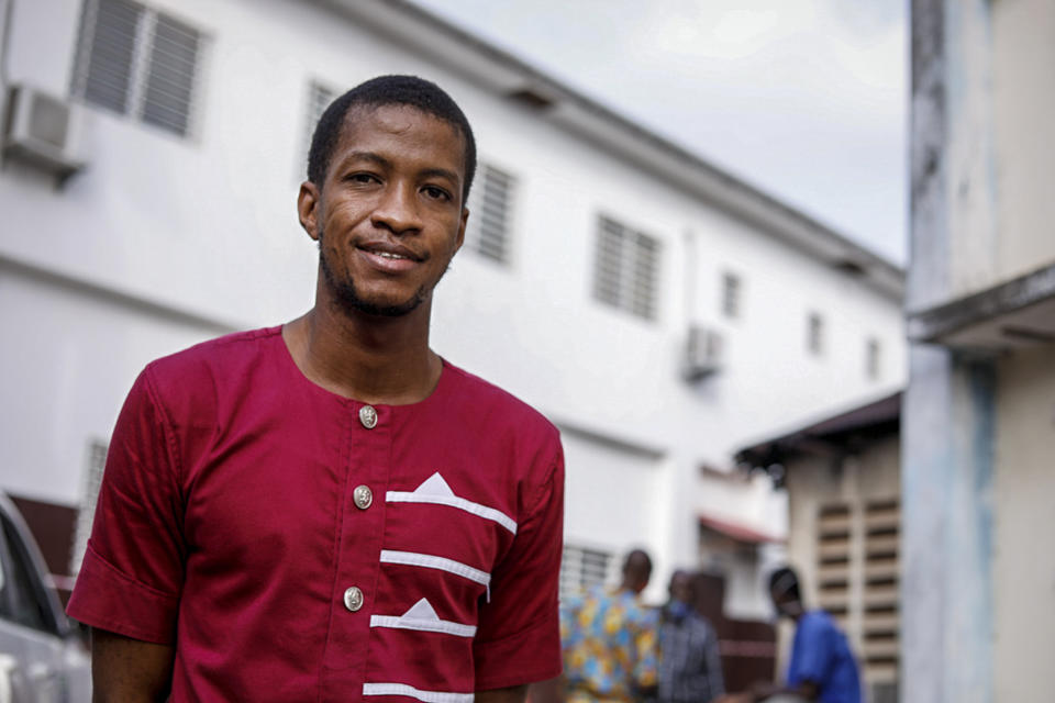 Dr. Mamadu Baldeh, one of only four physicians managing the COVID-19 unit and the only one doing so while still overseeing the infectious diseases unit, is photographed outside the Connaught Hospital where he works in the capital Freetown, Sierra Leone Friday, May 8, 2020. Despite the loss of colleagues, Baldeh is fighting not only to save his coronavirus patients but also to provide quality care for those afflicted with other infectious diseases as he and other health care workers fight for a better system. (Vicki Remoe/VRC Marketing via AP)