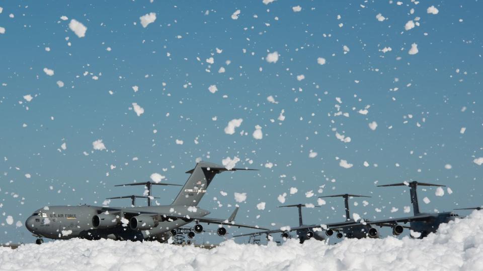Fire-retardant foam temporarily covered a small portion of the flight line at Travis Air Force Base in California after it was released inside a hangar on Sept. 24, 2013. (Ken Wright/Air Force)