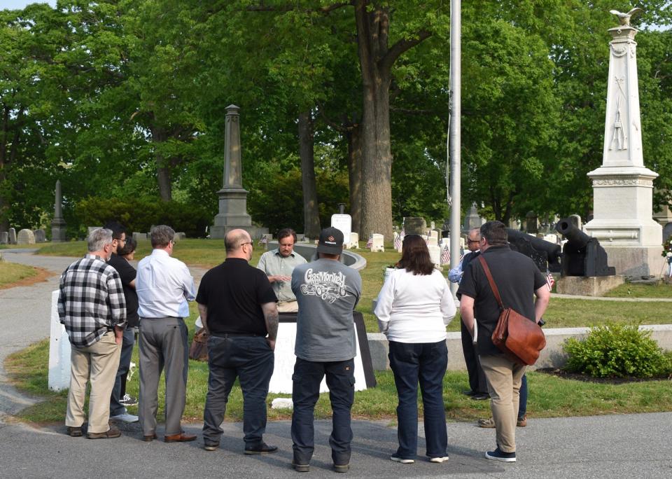 Casey-Lee Bastien, landscape architect with BSC Group, shows proposed changes during a tour of Oak Grove Cemetery on Wednesday, May 24.