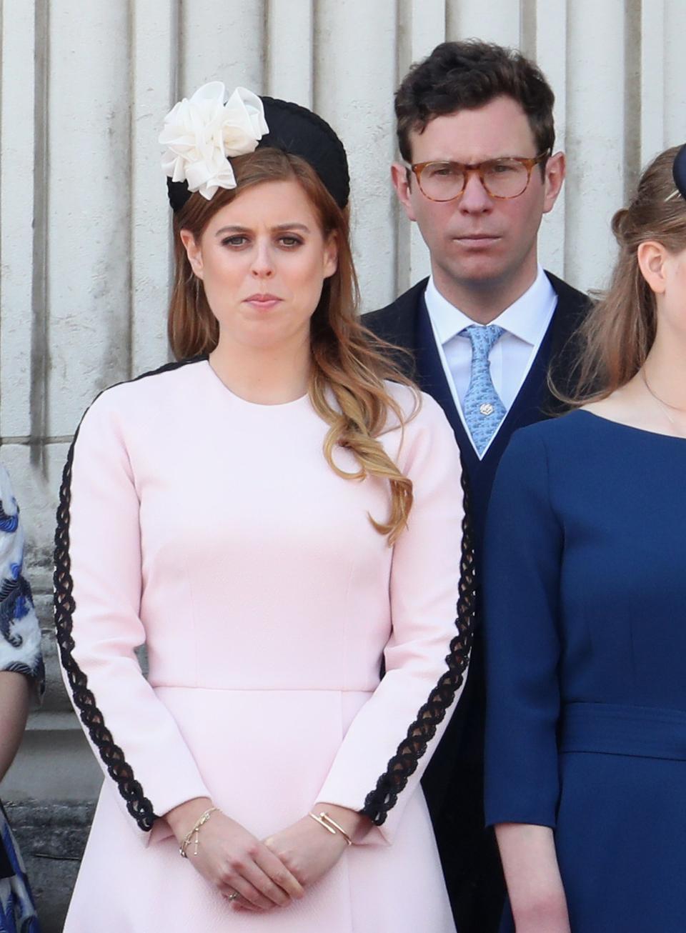 Princess Beatrice wears a pale pink dress with black lace on the sleeves
