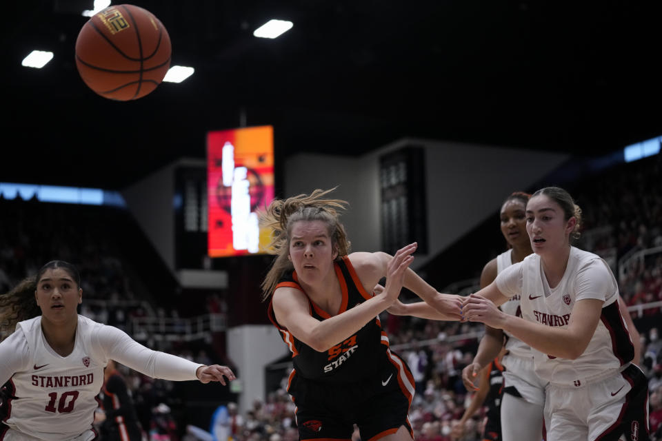 Oregon State forward Kelsey Rees, center, is unable to catch up to the ball before it went out of bounds during the first half of an NCAA college basketball game against Stanford, Sunday, Jan. 21, 2024, in Stanford, Calif. (AP Photo/Godofredo A. Vásquez)