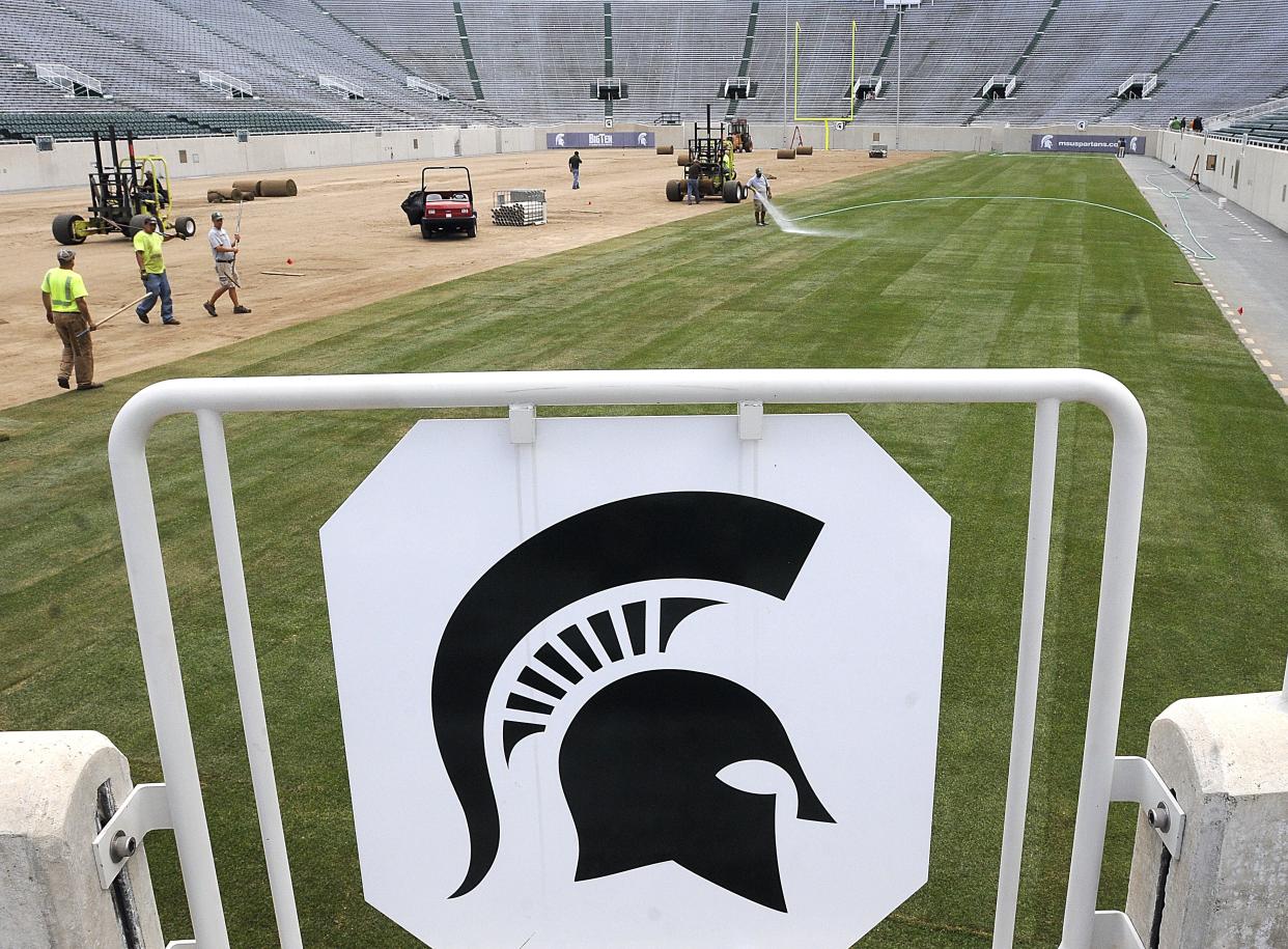 This 2011 photo shows crews installing turfgrass at Spartan Stadium. The Kentucky bluegrass will be removed and replaced this month with new grass.