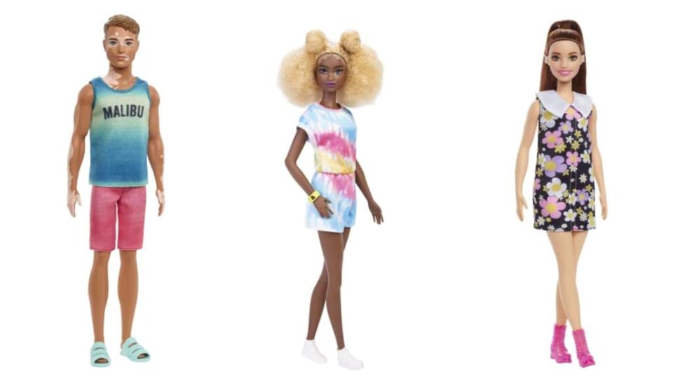 Ken doll with vitiligo, Black Barbie with Afro-puffs and Barbie with a hearing aid (Credit: Mattel)