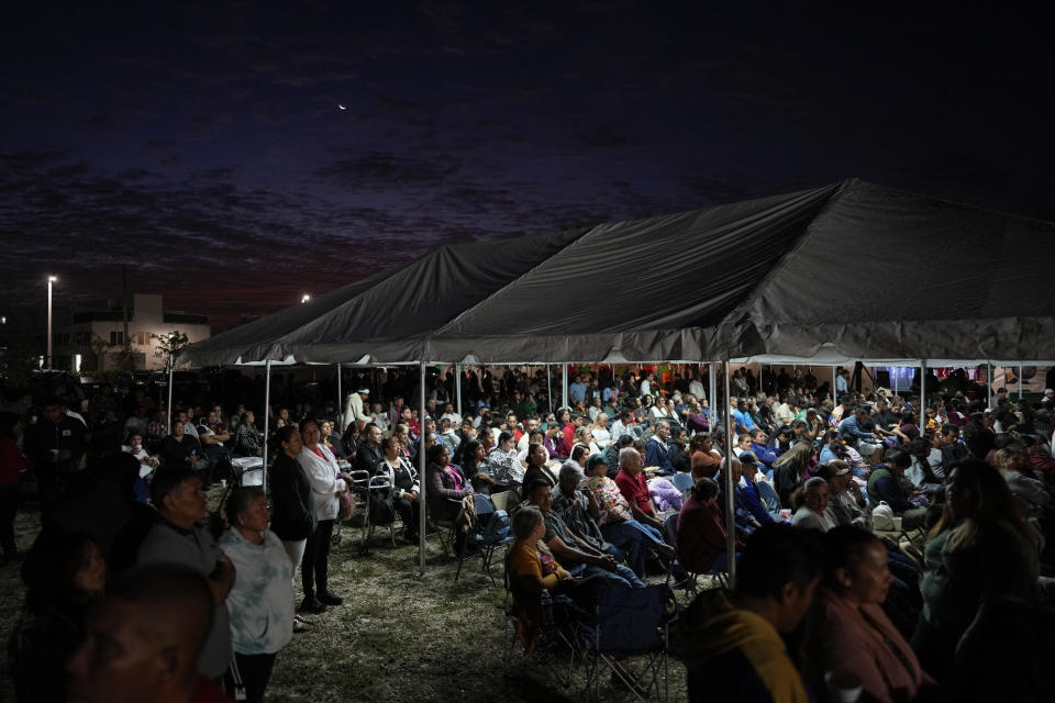 Devotees gather before dawn for a festival celebrating the Virgin of Guadalupe, one of several apparitions of the Virgin Mary witnessed by an indigenous Mexican man named Juan Diego in 1531, at St. Ann Mission in Naranja, Fla., Sunday, Dec. 10, 2023. For this mission church where Miami's urban sprawl fades into farmland and the Everglades swampy wilderness, it's the most important event of the year, both culturally and to fundraise to continue to minister to the migrant farmworkers it was founded to serve in 1961. (AP Photo/Rebecca Blackwell)