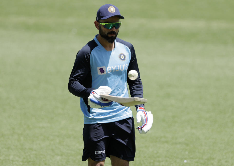 India's Virat Kohli warms up ahead of the one day international cricket match between India and Australia at the Sydney Cricket Ground in Sydney, Australia, Sunday, Nov. 29, 2020. (AP Photo/Rick Rycroft)