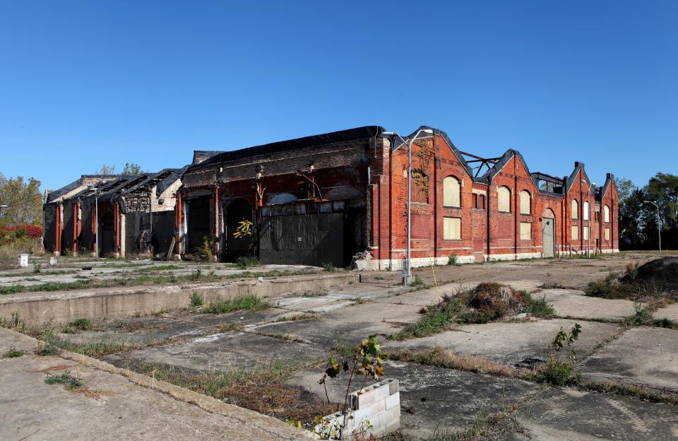 The Pullman monument, a stark, old, dilapidated building, stands in the middle of a cemented park.