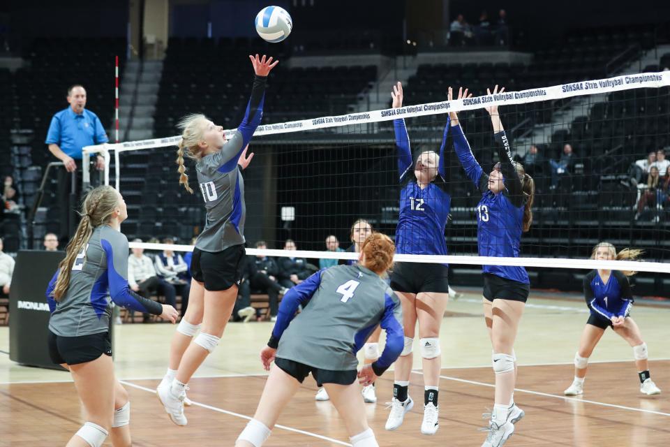 Sioux Falls Christian's Ellie Lems (10)  sets the ball Saturday night during the Class A state volleyball championship at The Summit Arena in Rapid City, S.D.  The Chargers won in 3 sets over the Garretson Blue Dragons.