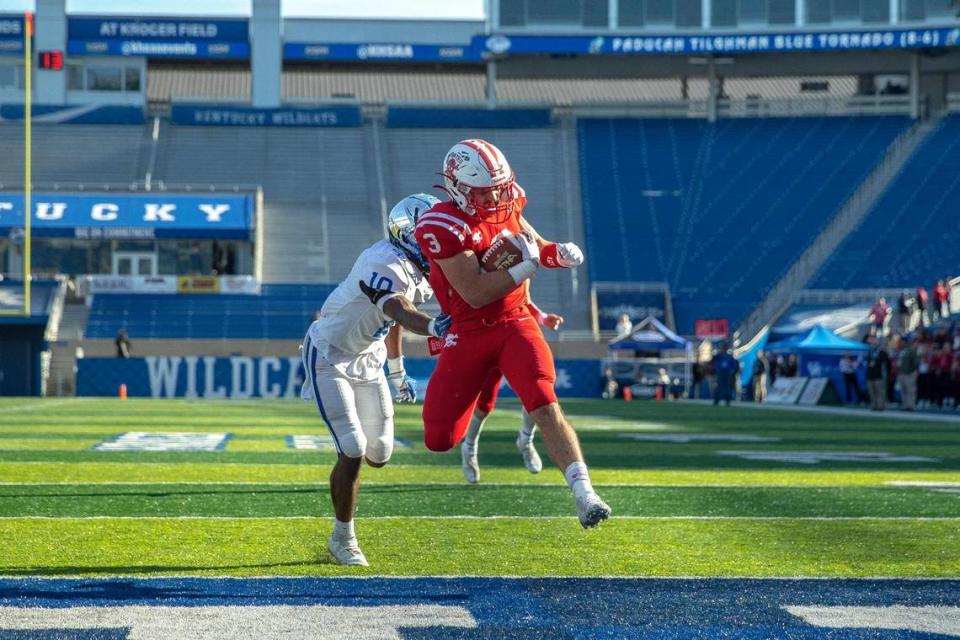 Belfry’s Isaac Dixon (3) runs past Paducah Tilghman’s Camdon Marshall (10) to score one of his five touchdowns at Kroger Field on Saturday. Dixon was named state finals MVP.