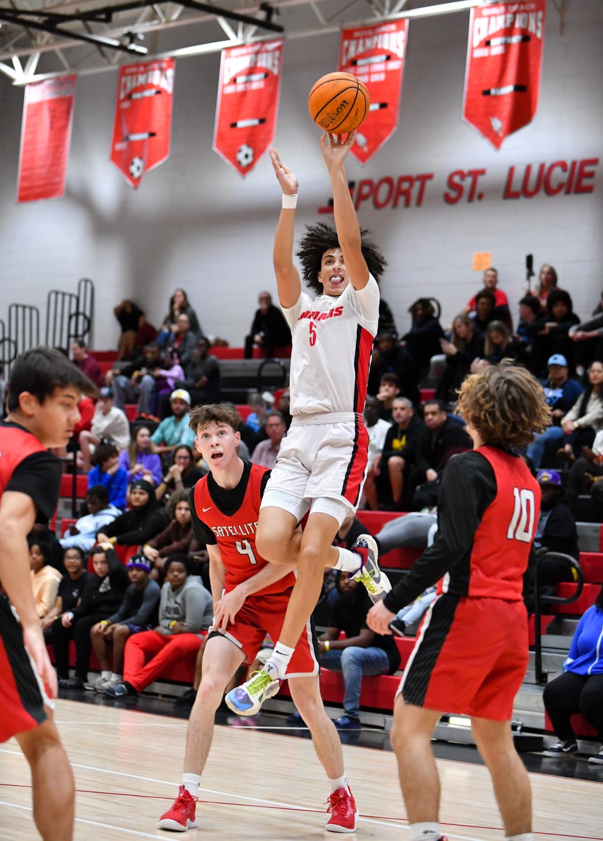 Port St. Lucie’s Ryan Rodriguez (5) hits a jump shot in a boys high school district 13-5A quarterfinal, Thursday, Feb. 8, 2024, in Port St. Lucie.