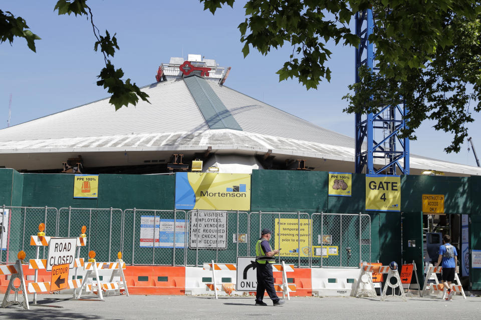 KeyArena, which is currently undergoing a complete renovation, is shown Thursday, June 25, 2020, in Seattle. Amazon has bought the naming rights to the arena, which will host a new NHL hockey team and the WNBA Basketball Seattle Storm, and will call the facility Climate Pledge Arena. (AP Photo/Ted S. Warren)
