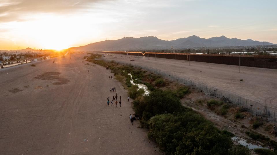 Migrants approach the Rio Grande from Mexico as they look to cross the Rio Grande on June 4, 2024.