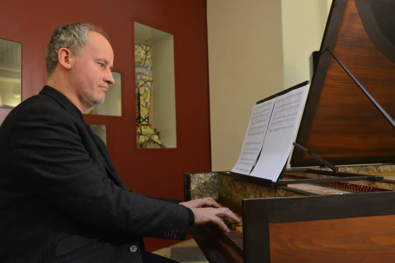 Czech musician Lukas Vendl plays after the recently discovered music notes composed by Austrian composer Wolfgang Amadeus Mozart and Italian composer Antonio Salieri in the Czech Music Museum in Prague on February 16, 2016