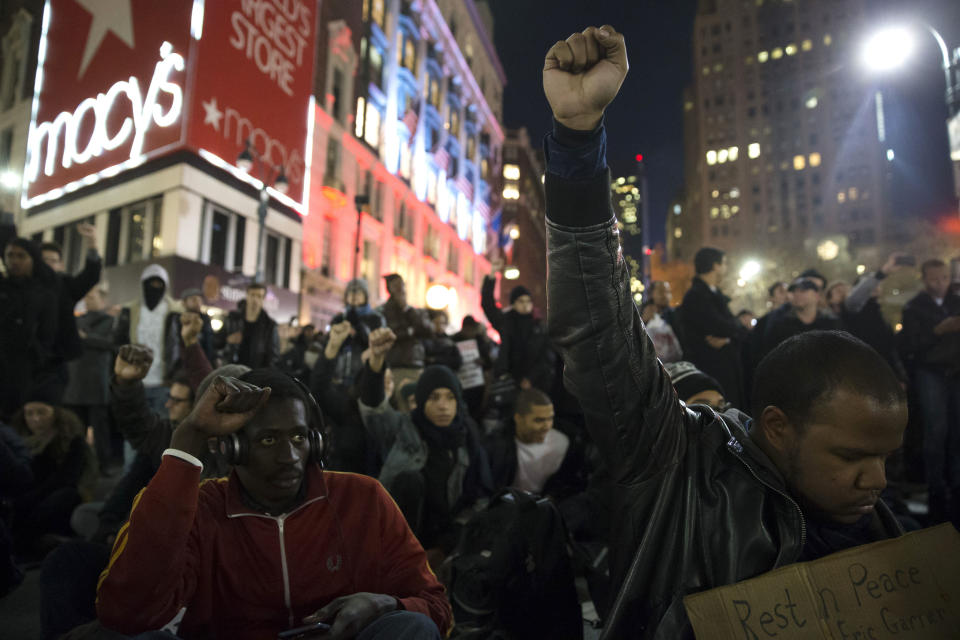 Protestors occupy Herald Square during march Thursday, Dec. 4, 2014, in New York, against a grand jury's decision not to indict the police officer involved in the death of Eric Garner. A grand jury cleared a white New York City police officer Wednesday in the videotaped chokehold death of Garner, an unarmed black man, who had been stopped on suspicion of selling loose, untaxed cigarettes, a lawyer for the victim's family said. (AP Photo/John Minchillo)