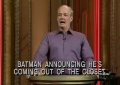 Colin at a podium with text reading, "Batman announcing he's coming out of the closet"