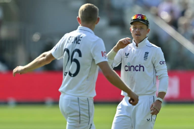 Crowd worry: England captain Ollie Pope (R), speaking with Olly Stone (L), was concerned by the low attendance for the fourth day of the second Test against Sri Lanka at Lord's (Glyn KIRK)